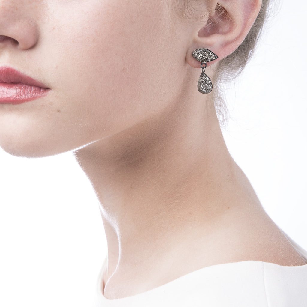 Image of Slant Fine Jewelry's silver vapor druzy & sterling earrings worn by a woman