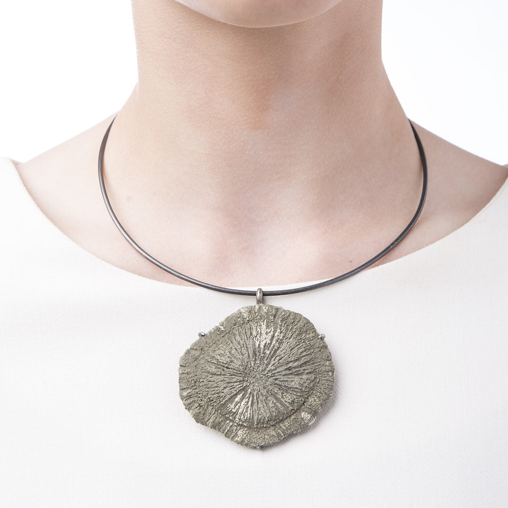 Image of Slant Fine Jewelry's sun pyrite choker necklace worn by a woman