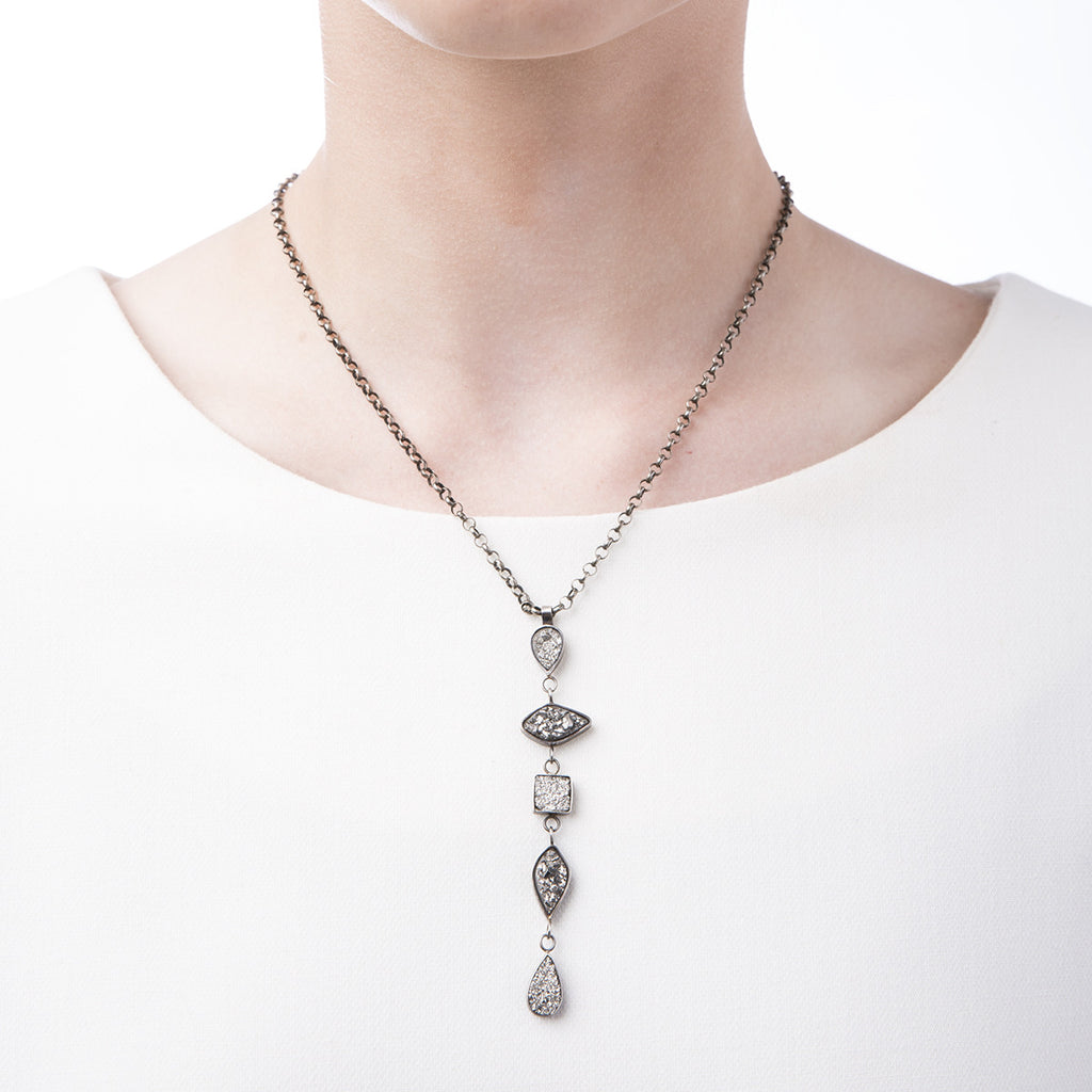 Image of Slant Fine Jewelry's silver vapor druzy & sterling tear drop necklace worn by a woman