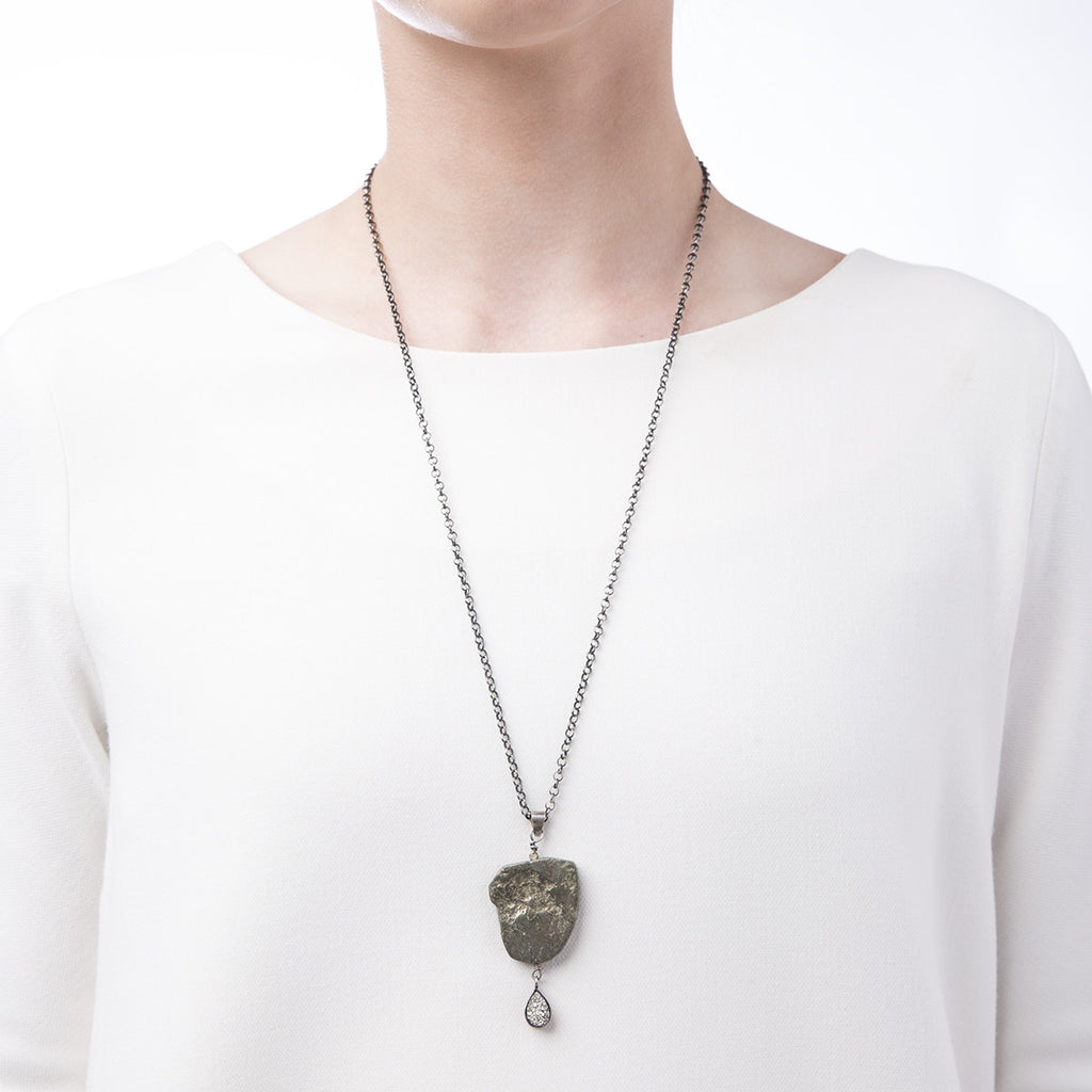 Image of woman wearing Slant Fine Jewelry's pyrite  and silver vapor druzy necklace
